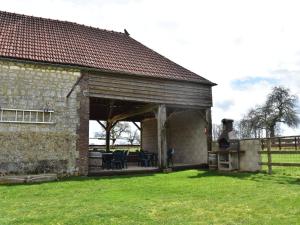 a pavilion with tables and chairs in a building at Spacious holiday home in Sormery with pool in Sormery