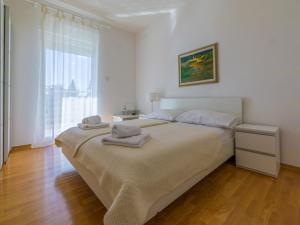 Postel nebo postele na pokoji v ubytování Villa CARPE DIEM