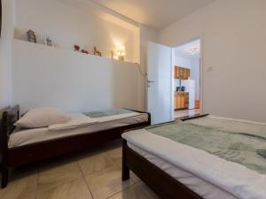 Posteľ alebo postele v izbe v ubytovaní Apartment Slavka