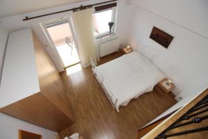 Posteľ alebo postele v izbe v ubytovaní Apartments IVONA 6