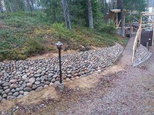 a pole on the side of a gravel road at Holiday Home Käkiharju by Interhome in Sulkava