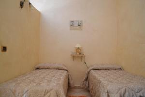 a room with two beds in a room at Appartamento Isola D'oro in Piazza Armerina +22 photos