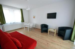 TV a/nebo společenská místnost v ubytování Toldi Apartments Pécs