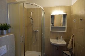 Koupelna v ubytování Toldi Apartments Pécs