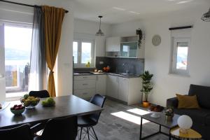 Kuchyň nebo kuchyňský kout v ubytování Maristo Apartments