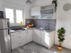 Kuchyň nebo kuchyňský kout v ubytování Maristo Apartments
