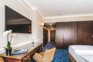 Postel nebo postele na pokoji v ubytování Hotel Suitess