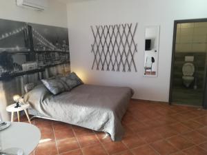 a bedroom with a bed and a picture on the wall at Guesthouse Porec in Poreč