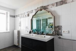 a bathroom with a sink and a mirror at Villa Rossella Sorrento in Sorrento +40 photos