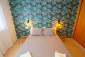 En eller flere senger på et rom på MEDANO4YOU Pearl Flavour Holiday Home
