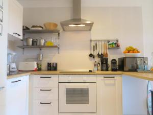 Kjøkken eller kjøkkenkrok på MEDANO4YOU Pearl Flavour Holiday Home