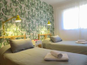 En eller flere senger på et rom på MEDANO4YOU Pearl Flavour Holiday Home