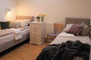 Posteľ alebo postele v izbe v ubytovaní Apartament Zielone Tarasy