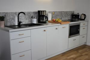 Kuchyňa alebo kuchynka v ubytovaní Apartament Zielone Tarasy