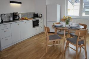 Kuchyňa alebo kuchynka v ubytovaní Apartament Zielone Tarasy