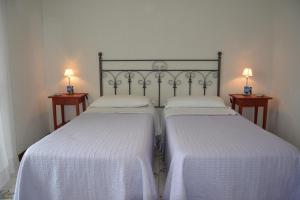 Säng eller sängar i ett rum på Le Cicale - Apartments