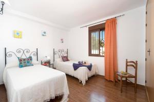 A bed or beds in a room at Villa fuente redonda