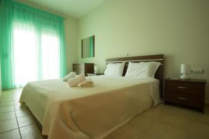 Postel nebo postele na pokoji v ubytování Stasa Luxury Apartments