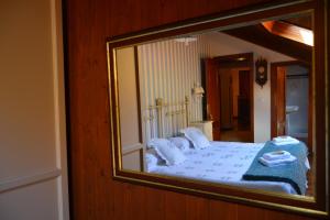 A bed or beds in a room at Núcleo de turismo Rural La Corte