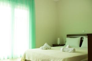 Postel nebo postele na pokoji v ubytování Stasa Luxury Apartments