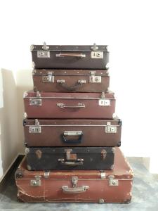 a stack of suitcases stacked on top of each other at Zanger Hotel in Goris