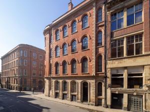 an old brick building on a city street at Apartment 16 Broadway House in Nottingham