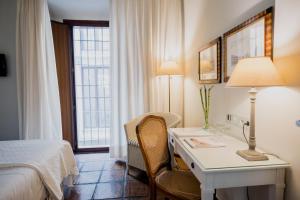 A bed or beds in a room at Palacio De Los Navas