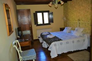 A bed or beds in a room at Núcleo de turismo Rural La Corte