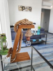 a rope sitting on top of a stand in a living room at Maristo Apartments in Stara Novalja