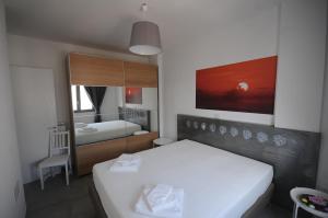 Uma cama ou camas num quarto em Appartamenti porta mare
