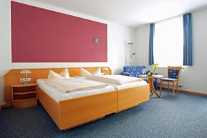 מיטה או מיטות בחדר ב-Weinstube Schwalbennest