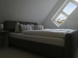 Letto o letti in una camera di Weinstube Schwalbennest