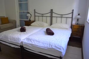 Postel nebo postele na pokoji v ubytování Villa Pomegrana