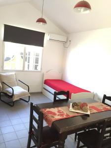 a bedroom with a bed and a table with cookies on it at Los Cerros 2 in Chilecito