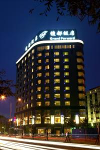 a building with a sign on the top of it at Grand Forward Hotel in Taipei