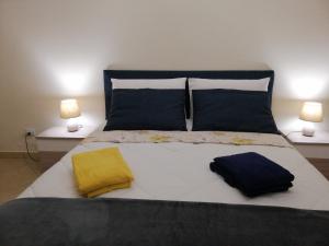 Ένα ή περισσότερα κρεβάτια σε δωμάτιο στο Appartamento Relax in centro