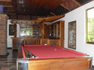 a billiard room with a pool table in it at Hotel El Doral in Monte Gordo