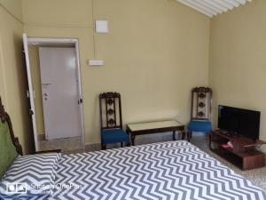 מיטה או מיטות בחדר ב-Leela's Cottage
