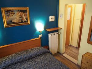 Voodi või voodid majutusasutuse Hotel Santa Croce toas