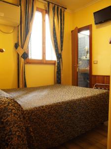Voodi või voodid majutusasutuse Hotel Santa Croce toas
