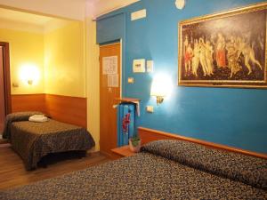 Voodi või voodid majutusasutuse Hotel Santa Croce toas