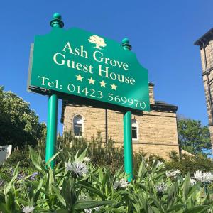 The logo or sign for the guesthouse 