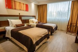 Postel nebo postele na pokoji v ubytování Hotel Libertador