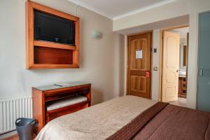 Postel nebo postele na pokoji v ubytování Hotel Libertador