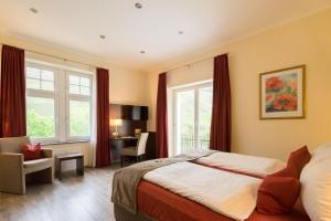 TV a/nebo společenská místnost v ubytování Boutique Hotel Villa Melsheimer