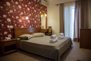 Postel nebo postele na pokoji v ubytování Hotel Liberty