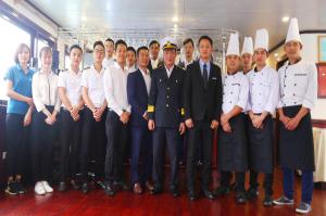 a group of people in uniform posing for a picture at Halong Sapphire Cruises in Ha Long