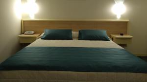 Postel nebo postele na pokoji v ubytování Hotel Bassetto