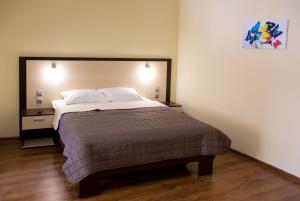 Postel nebo postele na pokoji v ubytování Hotel Complex Olimp + 8 fotografií