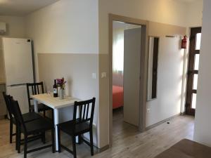 a dining room with a table and chairs and a bedroom at Villa Pinija in Fažana +14 photos